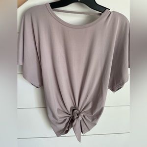 Popflex short sleeve shirt with tie in front and open back. Size extra small